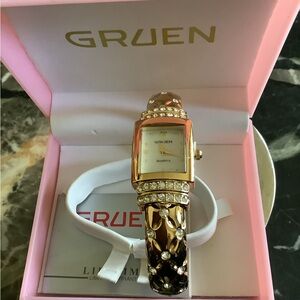 New in box Gruen gold tone faux diamond mother of pearl bangle bracelet watch